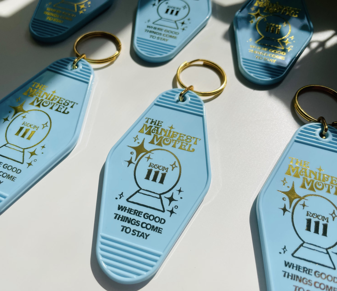 Blue Manifest Motel Keychain